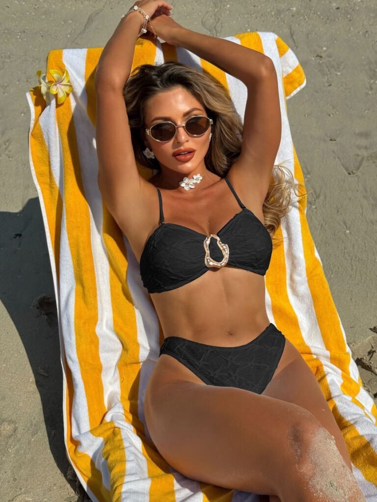 Model Wearing Shell Ring Bikini Set in Black – Lying on Towel